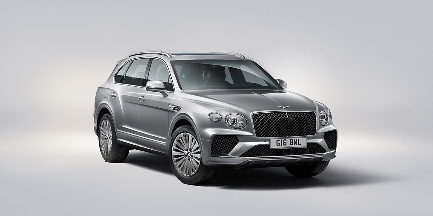 Bentley Douglas Bentley Bentayga luxury SUV front three quarter view in Moonbeam paint with matrix grille and 21″ 5 spoke painted wheels