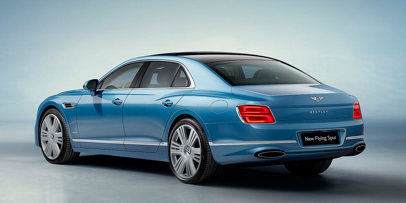 Bentley Douglas New Bentley Flying Spur Azure sedan rear view in Light windsor blue by Mulliner paint with 22 inch Azure wheels and chrome exterior details