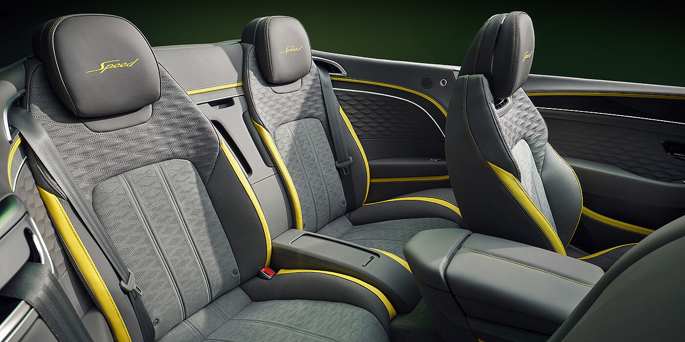 Bentley Douglas Bentley New Continental GTC Speed convertible rear interior with unique Speed colour split in Gravity Grey and Cyber Yellow hide colours, and contrast stitched headrest emblems 