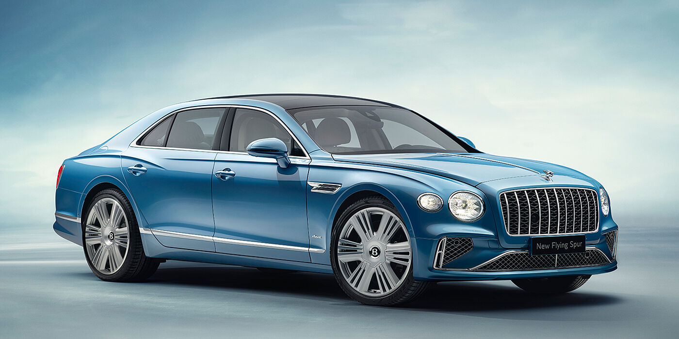 Bentley Douglas New Bentley Flying Spur Azure sedan front view in Light windsor blue by Mulliner paint with 22 inch Azure wheels and chrome exterior details