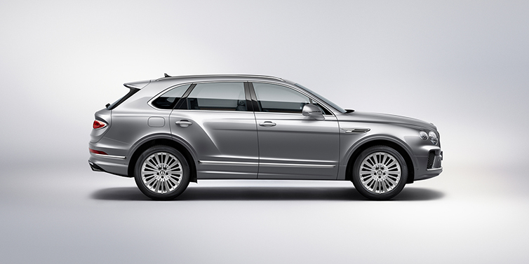Bentley Douglas Bentley Bentayga SUV side profile in Moonbeam silver paint against white background featuring 21 inch 5 spoke wheels